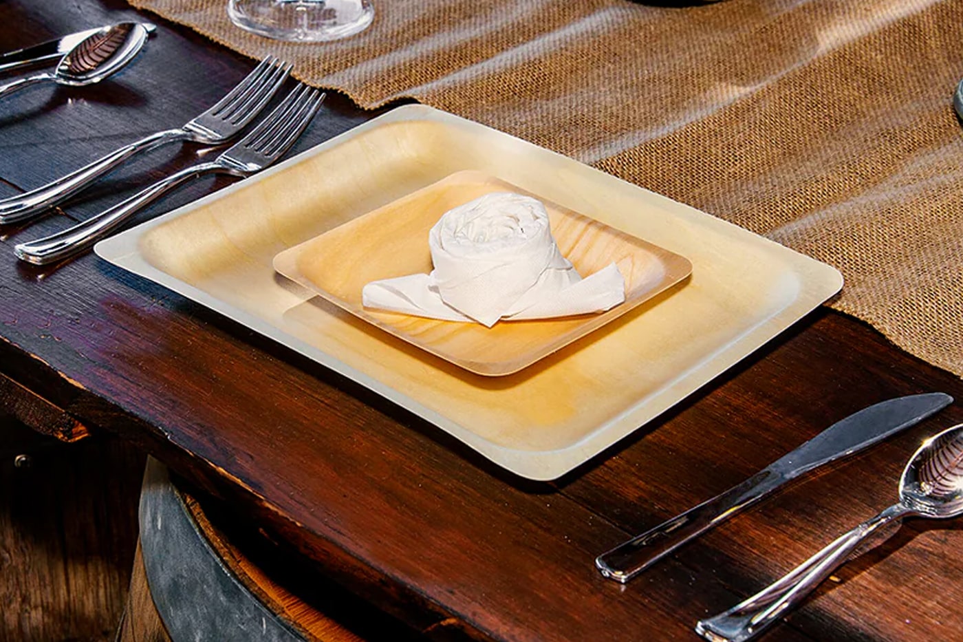 wooden plates, spoon and fork on the table